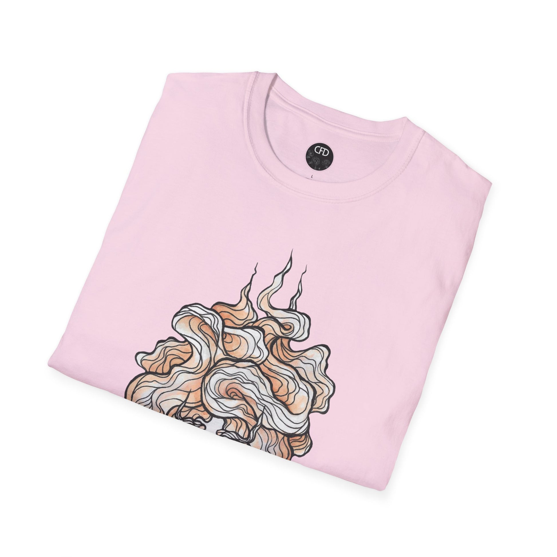 This is the Light Pink English Breakfast Tea T-Shirt by Chris Foster Design. It comes in sizes XS-5XL. This is an image of the shirt folded with a circular CFD logo in white lettering and black background. The size label is below the logo in black. The top of the English Breakfast Tea illustration which shows the mist swirling around in light pink, red and white. The shirt is against a white background.