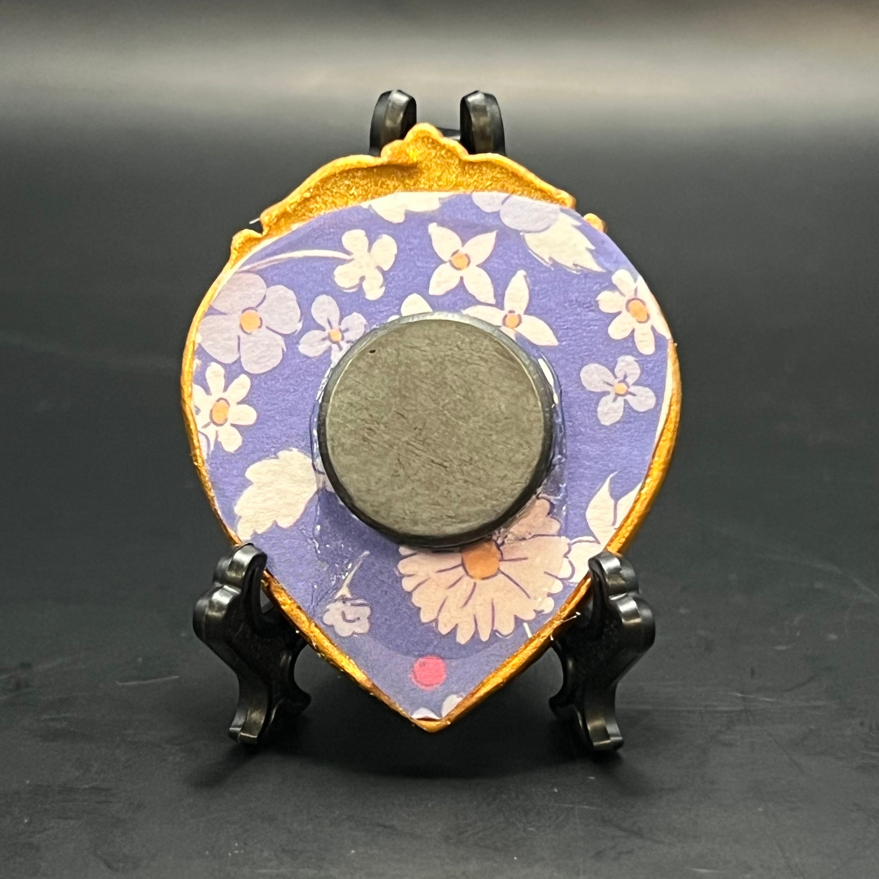 Close-up of the textured brushstrokes and delicate color gradation on the Lily of the Valley mini painting’s upper corner.