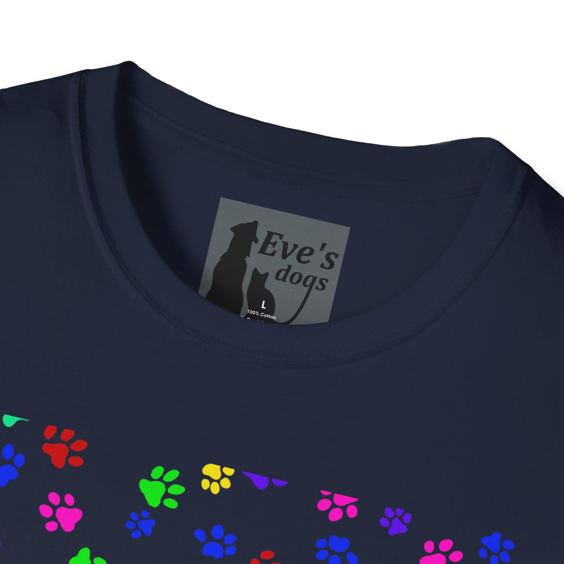 This is the Navy Adopt Eve's Dogs T-Shirt. It comes in XS - 5XL. This is an upclose image of the shirt where the neck/tag is. The size label is a grey and black tag with a dog and cat with the "Eve's dogs" writing. The sizes and shirt product materials are printed in white. There is a little bit of paw prints on the front.  The colors are pink, green, blue, purple, red paw prints in different sizes. It is against a white background.