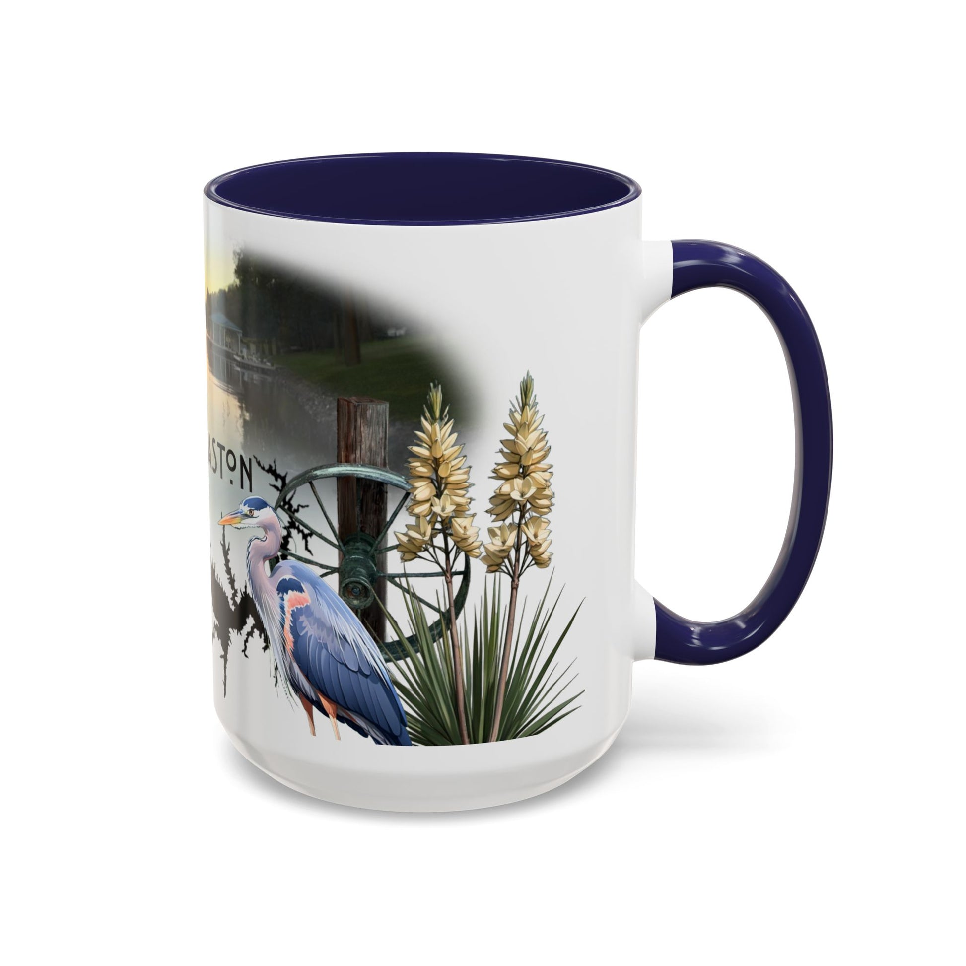 This is the 15oz Navy Lake Gaston Mug. It is an illustration by Lee Hansheng Studios. The picture is shown from the right side of the mug. The handle and inside of mug are color matched too. The mug is all white except for the illustration and handle. The illustration shows two yucca plants on the right, a great blue heron and a green wheel that is attached to a log. The mug is against a white background in the picture too.