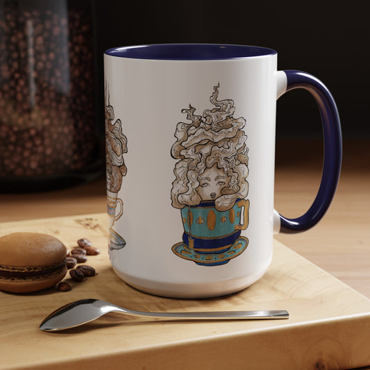 This is the Navy 15 oz Three Teas Mug by Chris Foster Design. This is the mug from the right side where the handle is. The handle and inside of the mug are both color matched. The cup body is white. The illustration is called Earl Grey. A gold, light blue and dark blue teacup with a tan, yellow and white steam. The steam is swirly and goes up and outwards. In the middle is a lady's face. The mug is on a wooden board,  one chocolate macaroon, silver spoon and in the background there are beans in a jar.