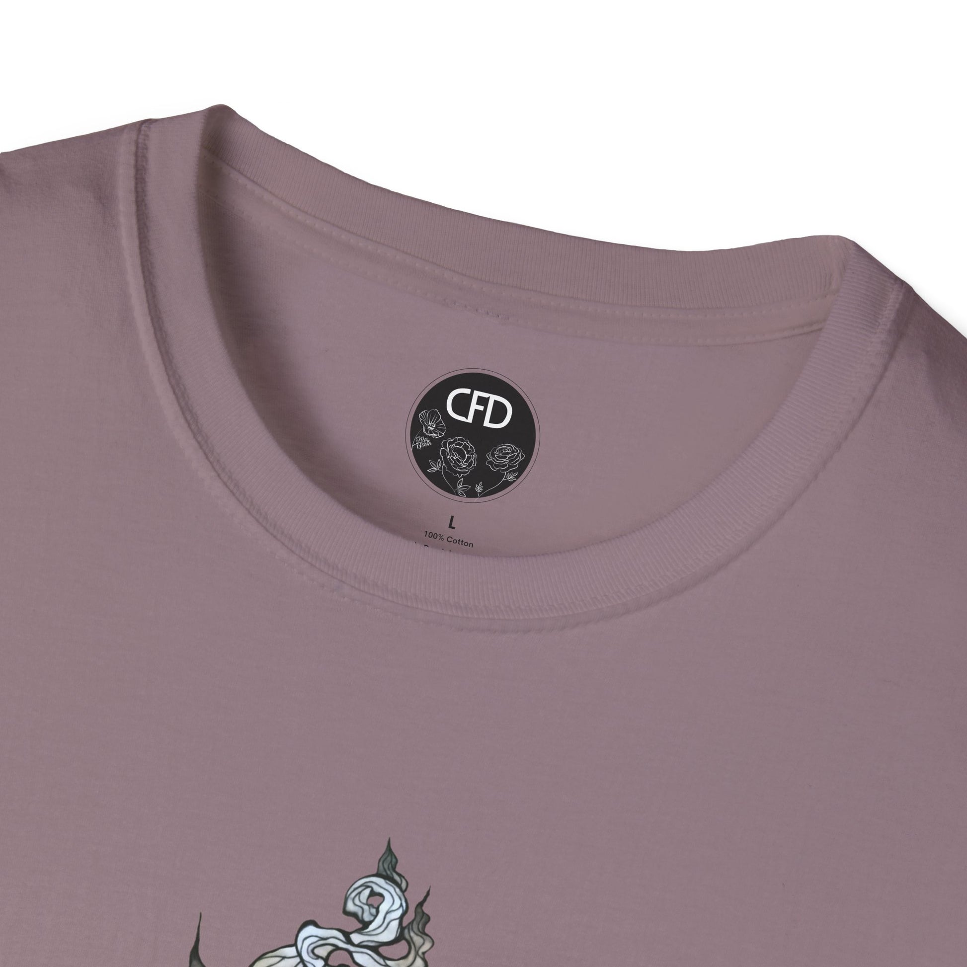 This is the Paragon Green Tea T-Shirt by Chris Foster Design.It comes in sizes XS-5XL. This image shows a close up of the front. There is the collar with CFD circular logo with flowers, has a black background and printed in white inside the shirt. The size label is printed in black. Below there is a bit of the illustration, some of the steam of the tea cup is shown in white and light blue. The shirt is against a white background.