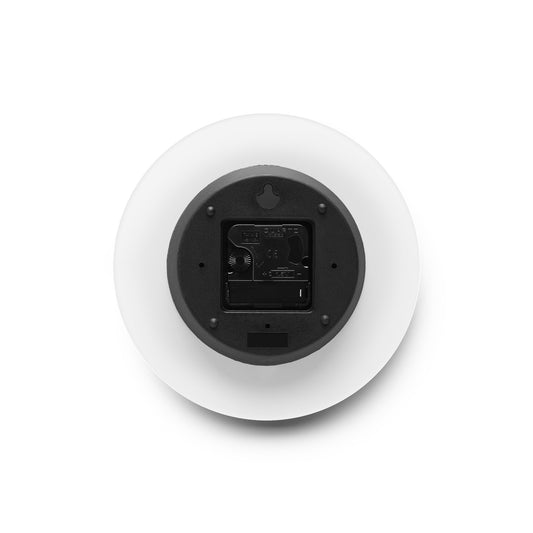 This is the 8" x 8" Pink Dreamscape Acrylic Round Wall Clock. The image showcases the back of the clock where the batteries would go. It has a black battery block and around it is white for the suface of the clock. It is against a white background.