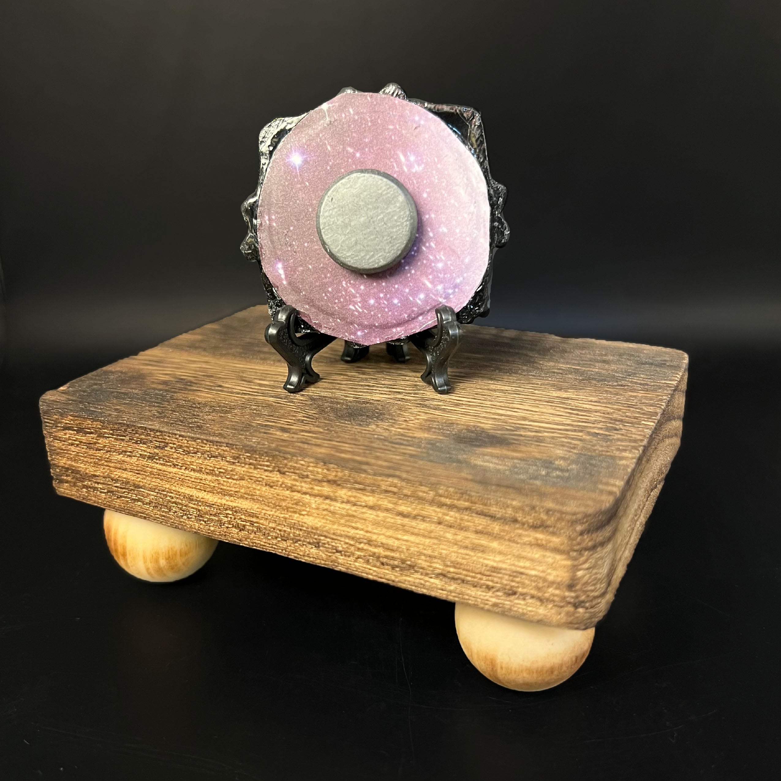 Close-up of the Shimmering Potion’s iridescent metallic label with holographic gemstone accents and intricate embossing