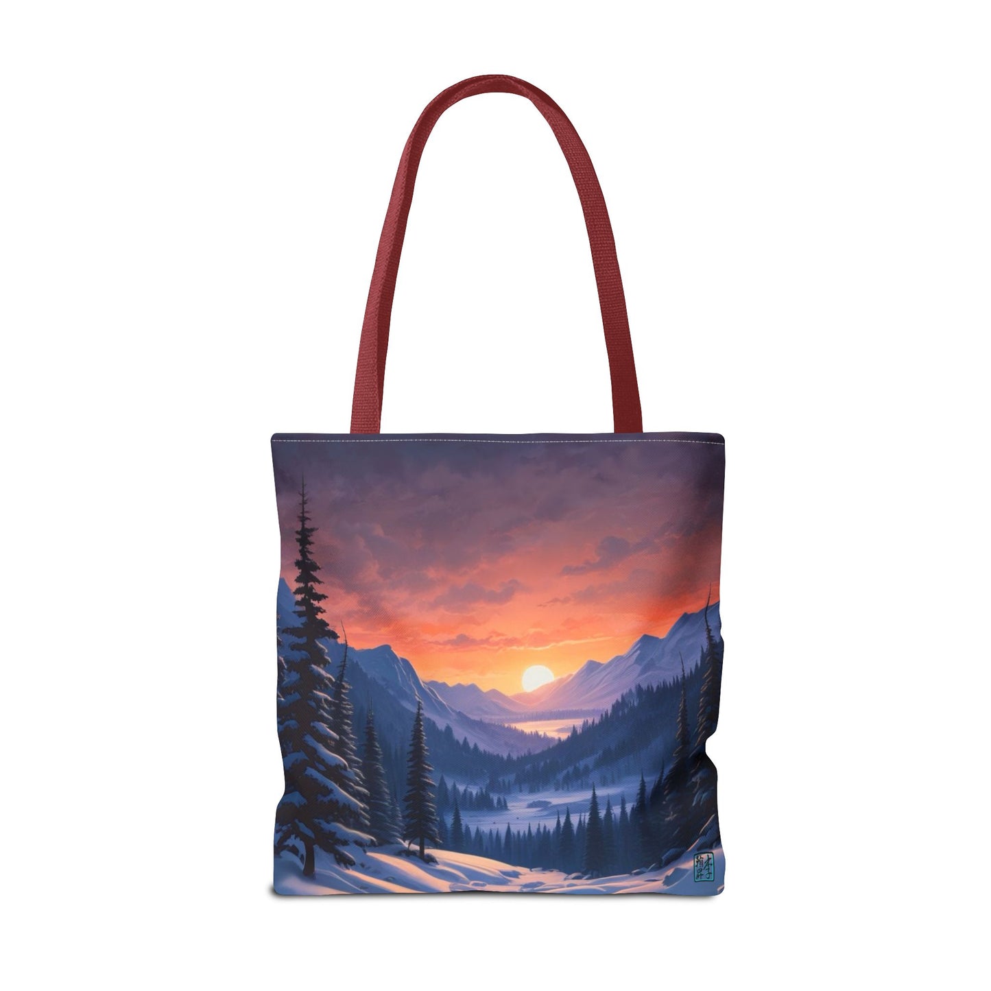 The Red 18" x 18" Snow Valley Tote Bag has color matched handles and all around print. The tote is against a white background.The design by Lee Hansheng Studios showcases a snowy hill/mountain area with large pine trees on both sides continuing into the horizon. The sun rises past the horizon consisting of yellow,orange,red hues illuminating onto wispy clouds,snowy field, mountains and dark green pine trees. 