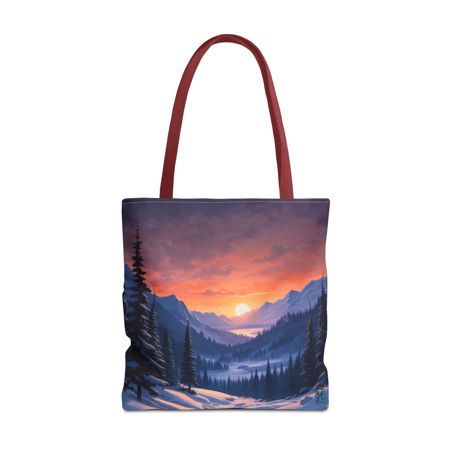 The Red 18" x 18" Snow Valley Tote Bag has color matched handles and all around print. The tote is against a white background.The design by Lee Hansheng Studios showcases a snowy hill/mountain area with large pine trees on both sides continuing into the horizon. The sun rises past the horizon consisting of yellow,orange,red hues illuminating onto wispy clouds,snowy field, mountains and dark green pine trees. 