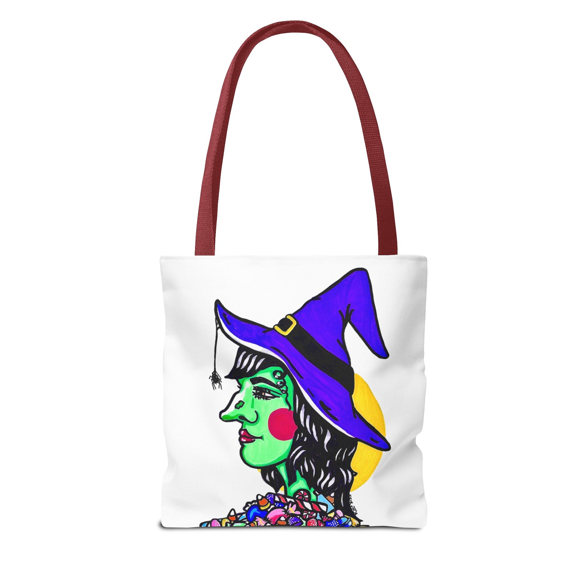 This is the Red 13" x 13" Witch Tote Bag by Storm Garden Studio. The handles are color matched. The tote is all over white except for the illustration. It shows the side profile image of a witch. She is facing the left side. She has a purple witch hat with a black belt, yellow buckle, a spider crawling down the front, red rosy cheeks, red lips and assorted candy under the neck. Behind her is a bright yellow circle past her hair. The tote is against a white background.