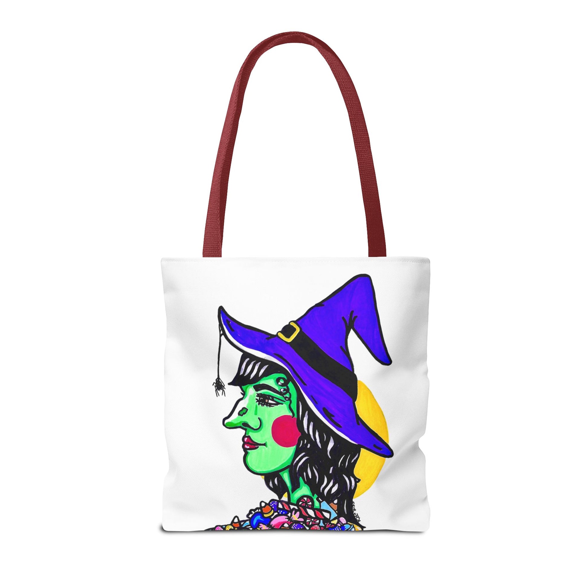 This is the Red 16" x 16" Witch Tote Bag by Storm Garden Studio. The handles are color matched. The tote is all over white except for the illustration. It shows the side profile image of a witch. She is facing the left side. She has a purple witch hat with a black belt, yellow buckle, a spider crawling down the front, red rosy cheeks, red lips and assorted candy under the neck. Behind her is a bright yellow circle past her hair. The tote is against a white background.