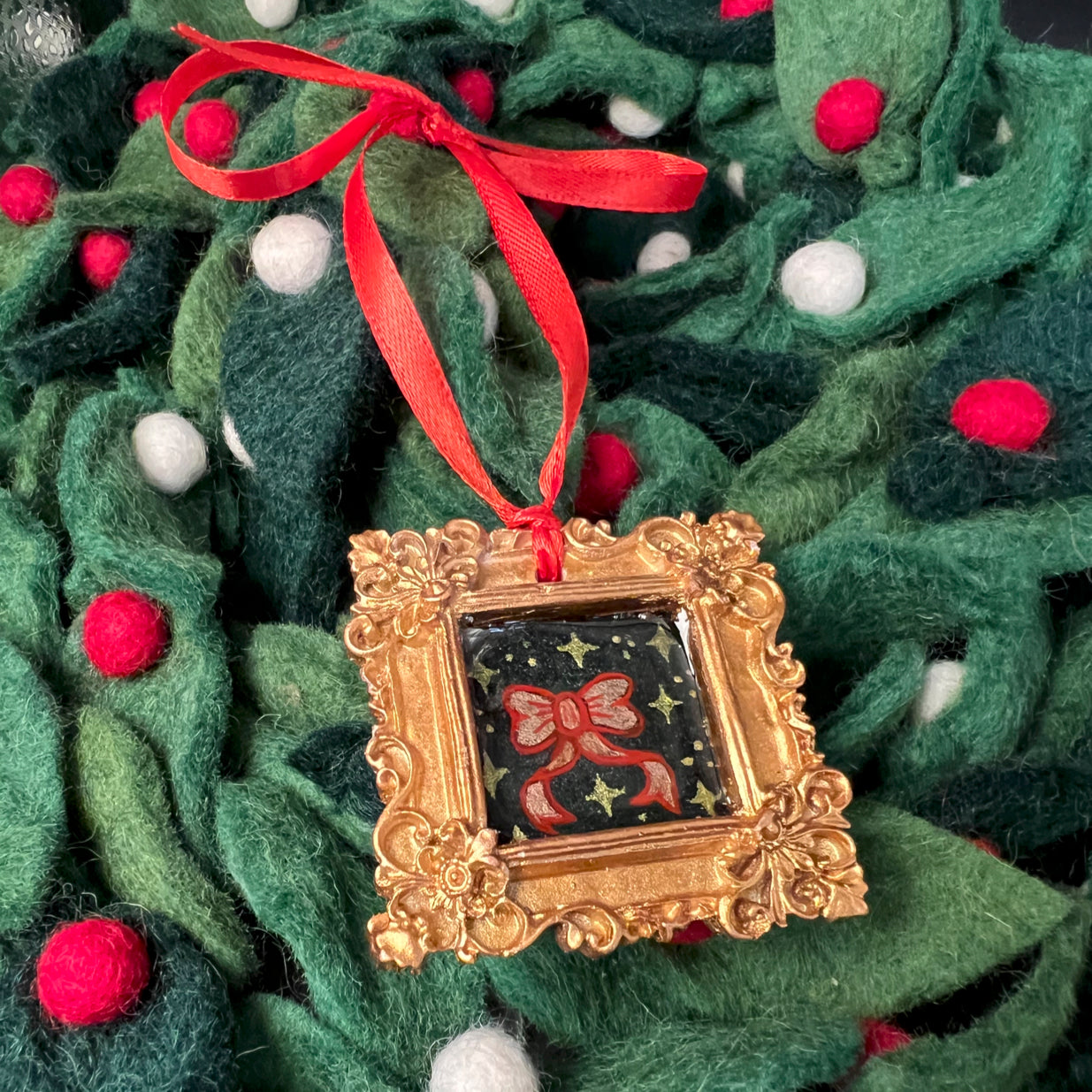 CFD Ribbon Ornament with woven satin ribbon, silver finish, 4-inch length, textured surface, branded by The Art Collective