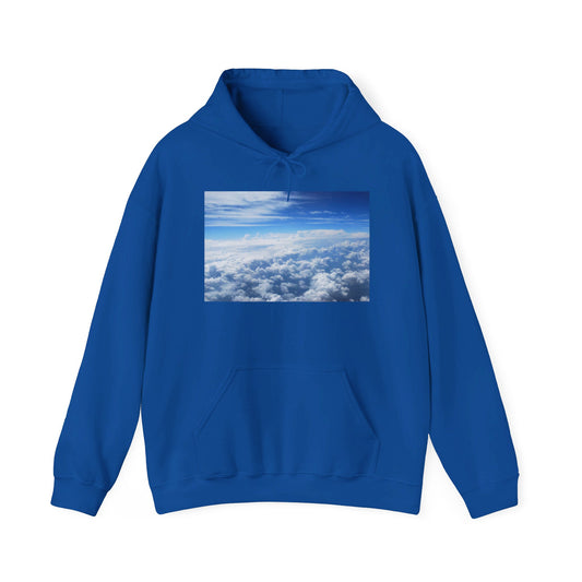 This is the Royal Above the Clouds Hoodie by Lee Hansheng Studios. It comes in sizes S-5XL. This is the image of the front with a drawstring tied in a bow and color matched. The illustration on the front chest. The illustration shows an overview of the clouds from the sky. Through the foreground are white, light blue, dark blue fluffy clouds that straighten out in the background. There are clear blue skies in the background. There is a kangaroo pocket, hemming on the wrists and end of the hoodie.
