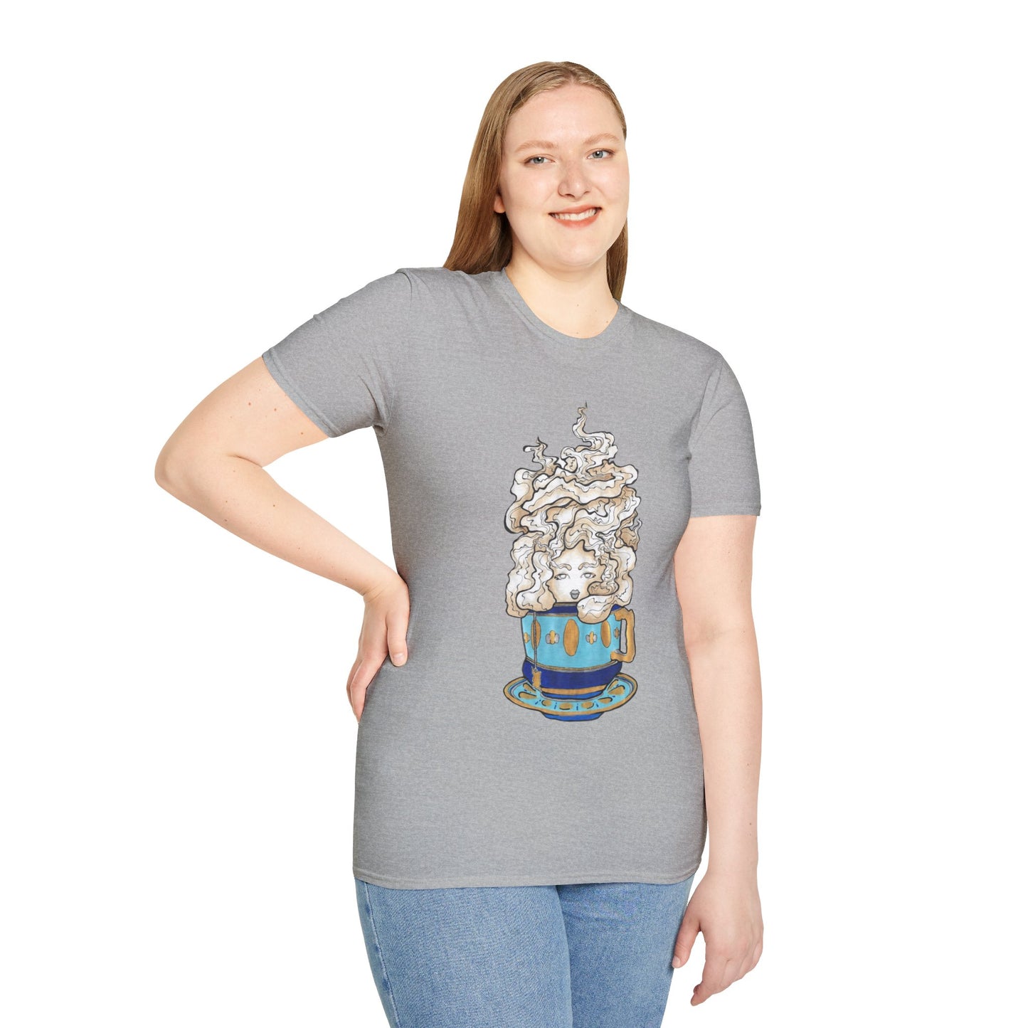 This is the Sport Grey Earl Grey Softstyle T-Shirt by Chris Foster Design. It comes in sizes XS-5XL. The illustration is of a gold, light blue and dark blue teacup with a tan, yellow and white steam. The steam is swirly and goes up and outwards. In the middle is a lady's face. A smiling lady facing the front with her head tilted slightly to the left, hair behind shoulders, right hand on waist, other hand hanging naturally and is wearing dark jeans and the designed t-shirt. 