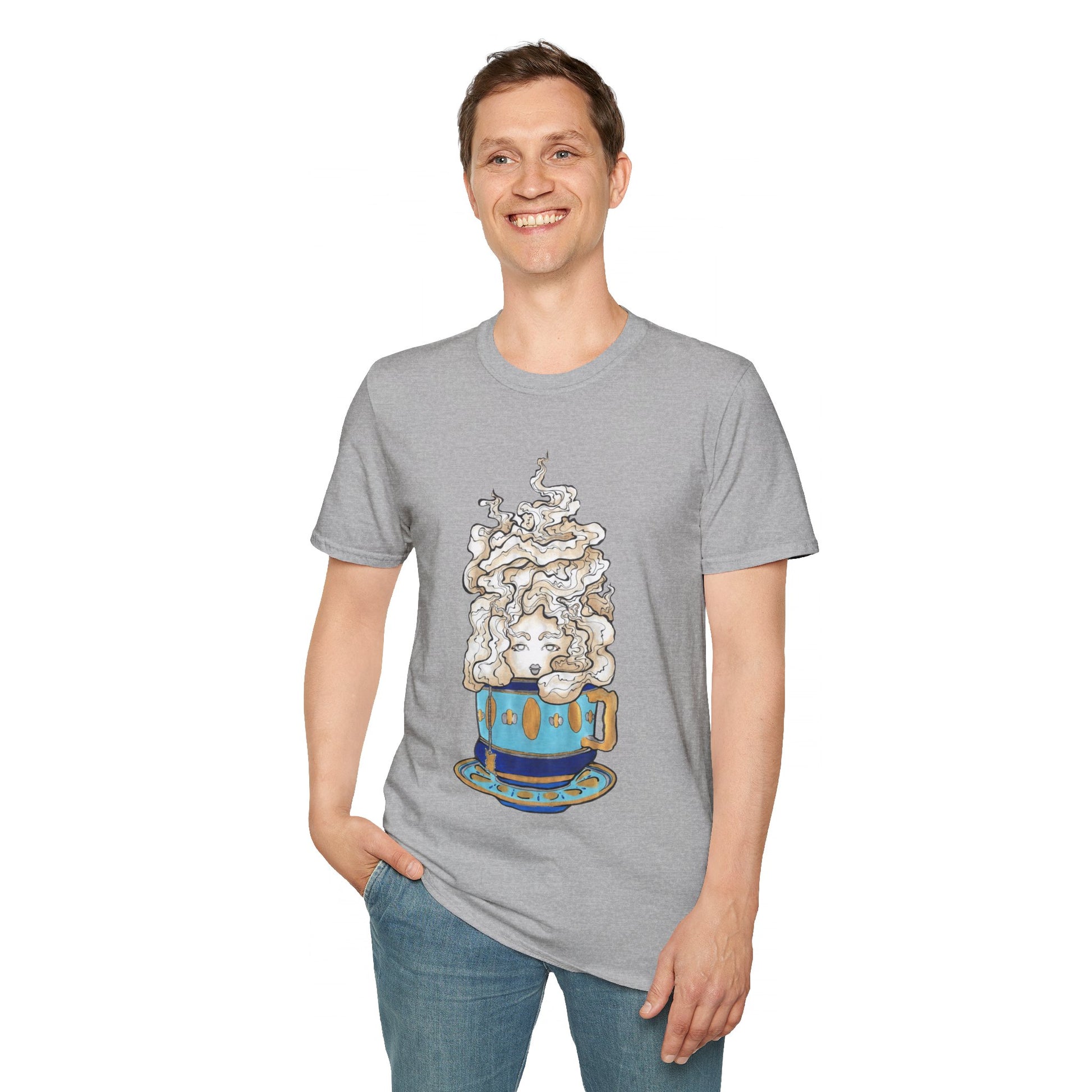 This is the Sport Grey Earl Grey Softstyle T-Shirt by Chris Foster Design. It comes in sizes XS-5XL. The illustration is of a gold, light blue and dark blue teacup with a tan, yellow and white steam. The steam is swirly and goes up and outwards. In the middle is a lady's face. A smiling man has his right hand in the jean pocket wearing the shirt and the other hand by his side. He is slightly looking to the left while standing against a white background.