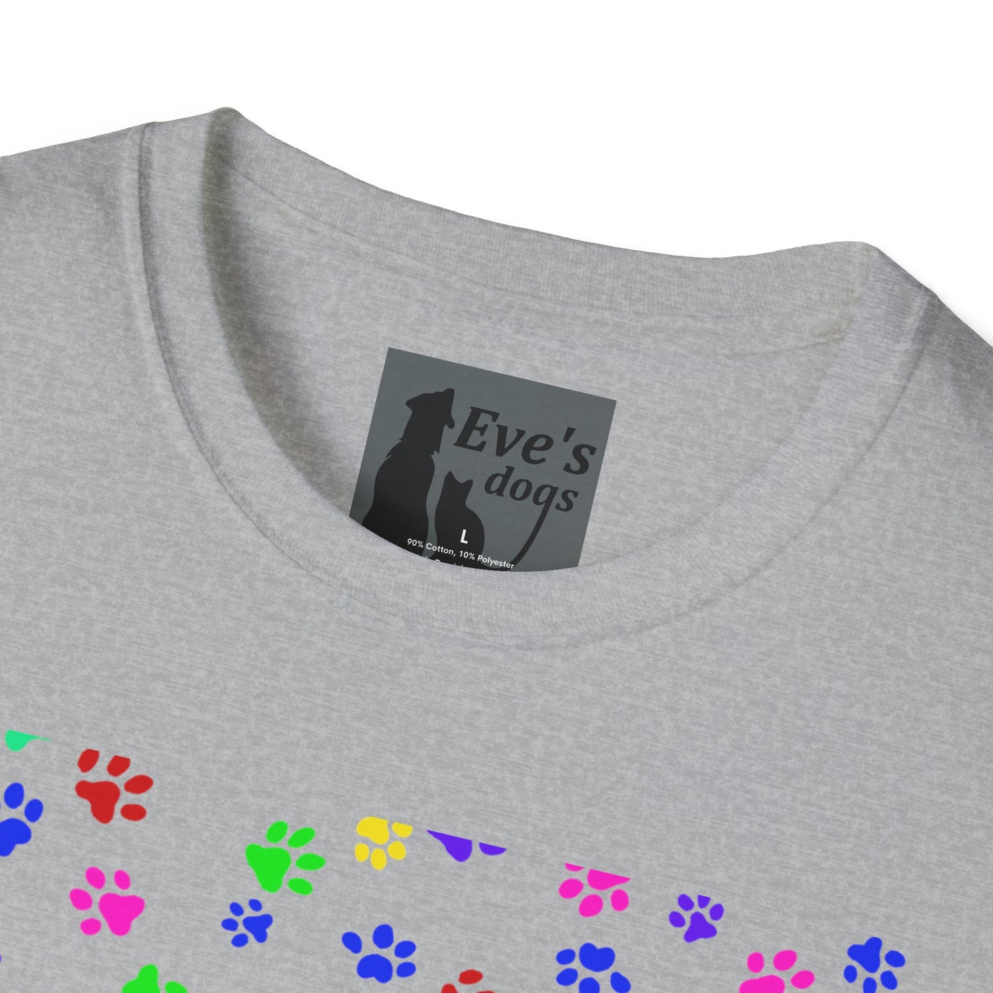This is the Sport Grey Adopt Eve's Dogs T-Shirt. It comes in XS - 5XL. This is an upclose image of the shirt where the neck/tag is. The size label is a grey and black tag with a dog and cat with the "Eve's dogs" writing. The sizes and shirt product materials are printed in white. There is a little bit of paw prints on the front.  The colors are pink, green, blue, purple, red paw prints in different sizes. It is against a white background.