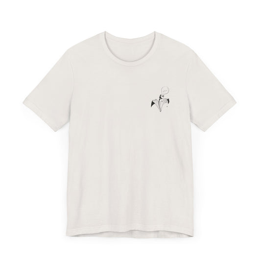 This is the Vintage White Trick or Treat! Witch T-Shirt by Storm Garden Studio. This is the front of the shirt. There is the studio's logo on the left breast pocket area. It is a plant with two leaves, lightbulb for the flower with a spider crawling upon the right printed in black. This shirt is against a white background.