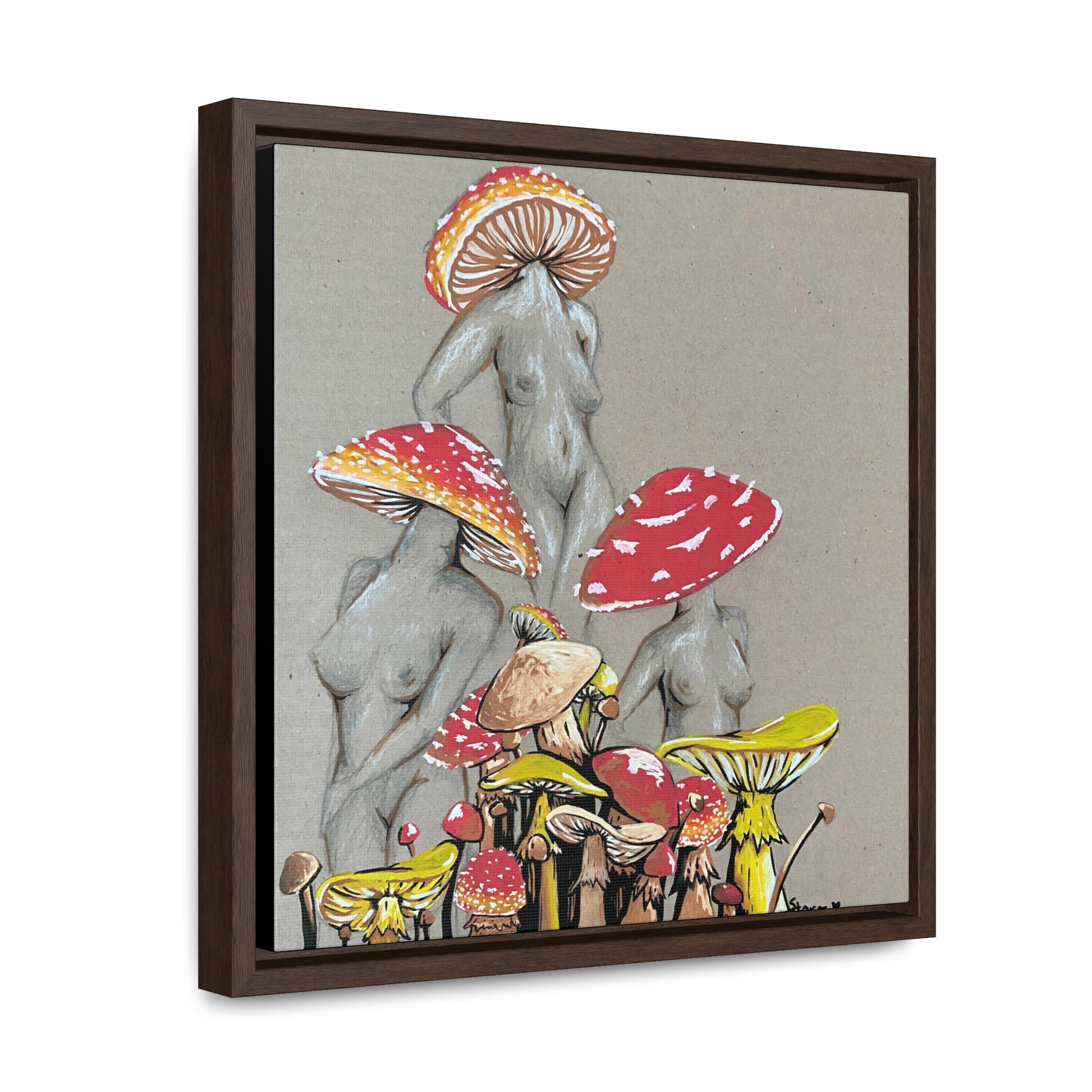 This is the 12" x 12" Miss Amanita Gallery Canvas Wrap with Walnut Square Frame by Storm Garden Studio. The depth of the frame is 1.25".The image shows the canvas tilted towards the left on a white wall. This is an illustration of three mushroom headed nude women. The foreground has assorted mushrooms in different sizes. The women are positioned in a triangle shape. The colors range from yellow,orange and red.Each of the bodies are shaded in white,black or grey and match the background of the illustration. 