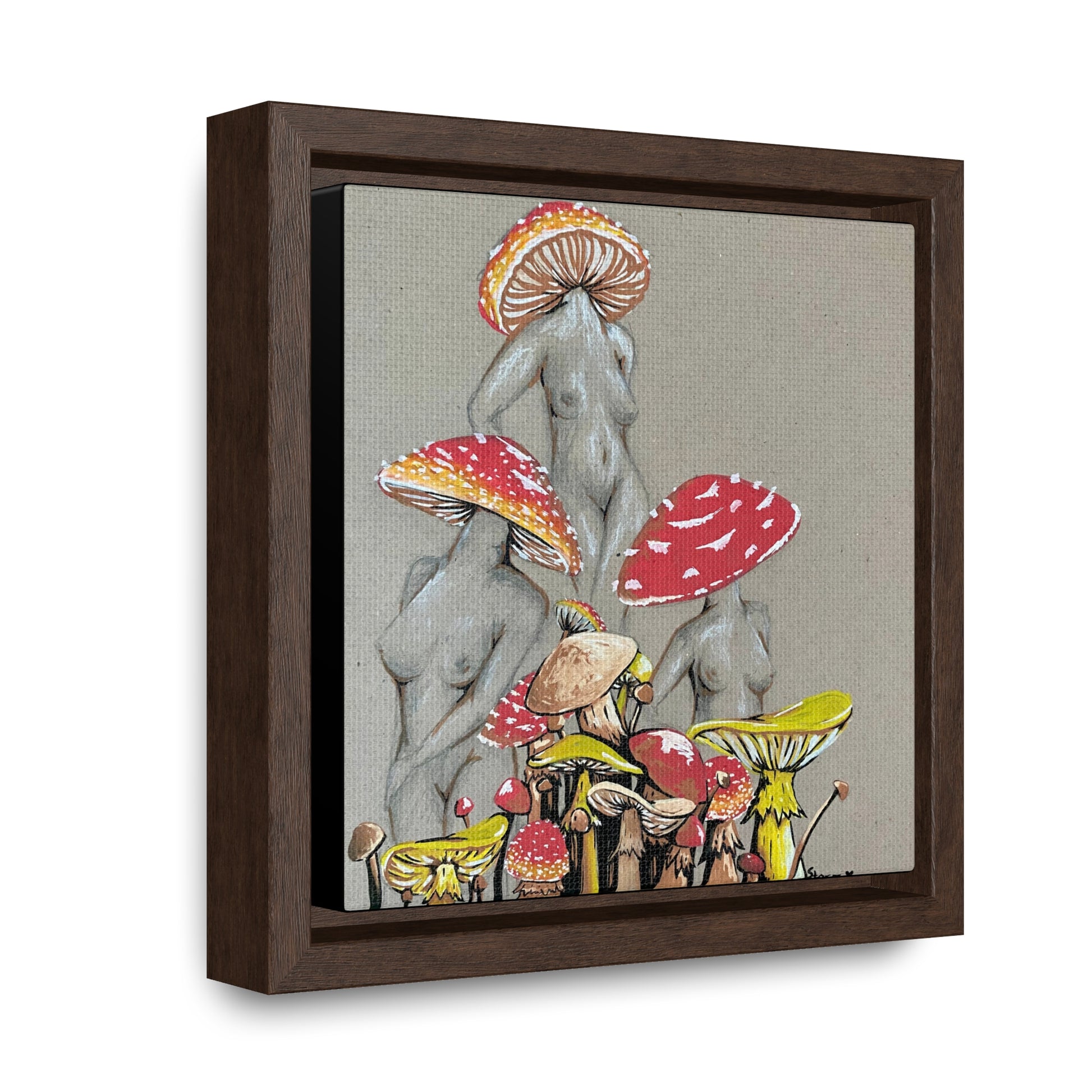 This is the 6" x 6" Miss Amanita Gallery Canvas Wrap with Walnut Square Frame by Storm Garden Studio. The depth of the frame is 1.25".The image shows the canvas tilted towards the left on a white wall. This is an illustration of three mushroom headed nude women. The foreground has assorted mushrooms in different sizes. The women are positioned in a triangle shape. The colors range from yellow,orange and red.Each of the bodies are shaded in white,black or grey and match the background of the illustration. 