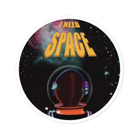 This is the White 2" x 2" I NEED SPACE Round Sticker Indoor/Outdoor by Lee Hansheng Studios. The illustration has yellow writing that says "I NEED SPACE", a starry sky that is black, a nebula colored blue and pink, white stars spread throughout and an astronaut wearing an orange jumpsuit staring at the stars and letters. It is against a white background.