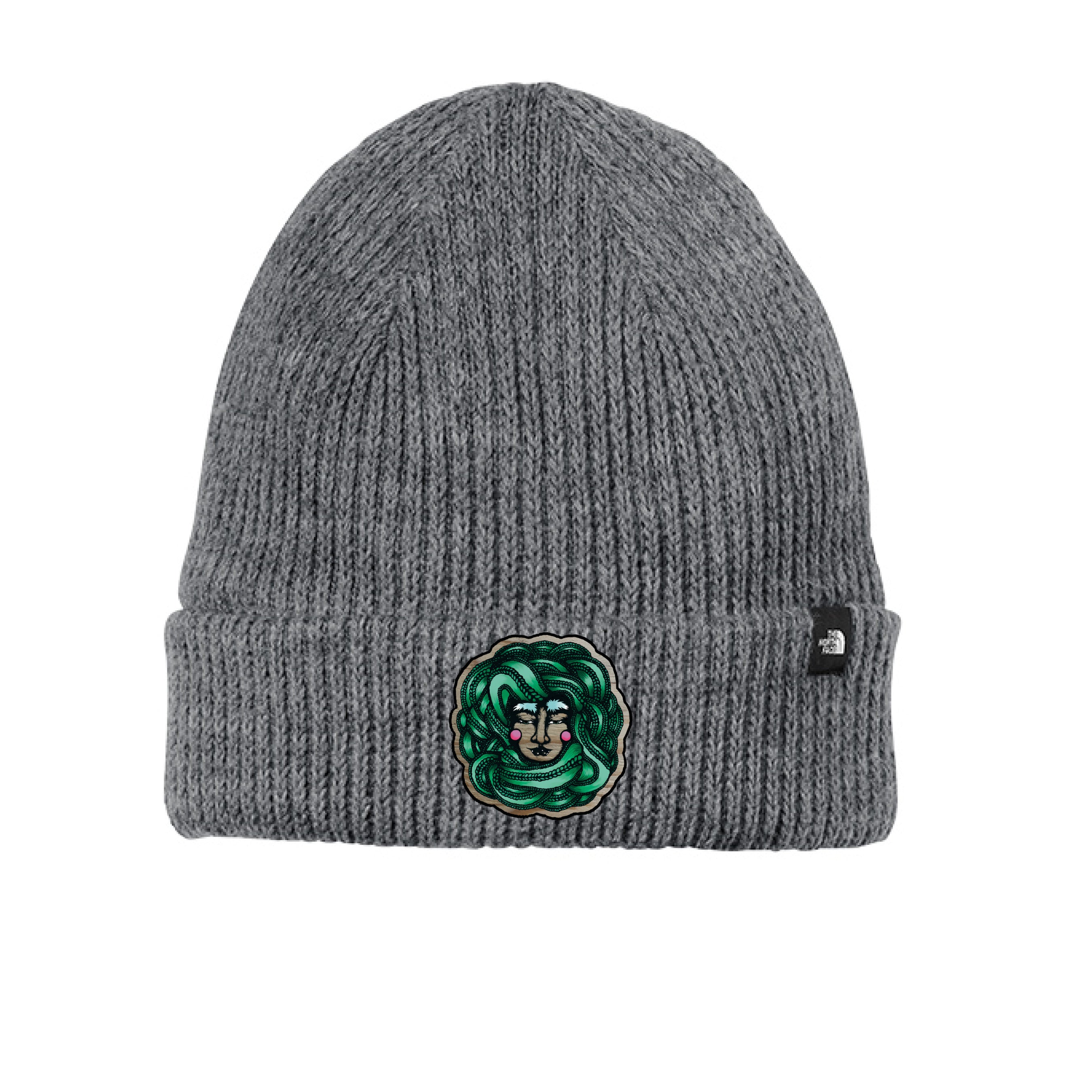 Close-up of the Winter Goddess Beanie's soft knit fabric showing intricate ribbing and subtle snowflake embroidery detail