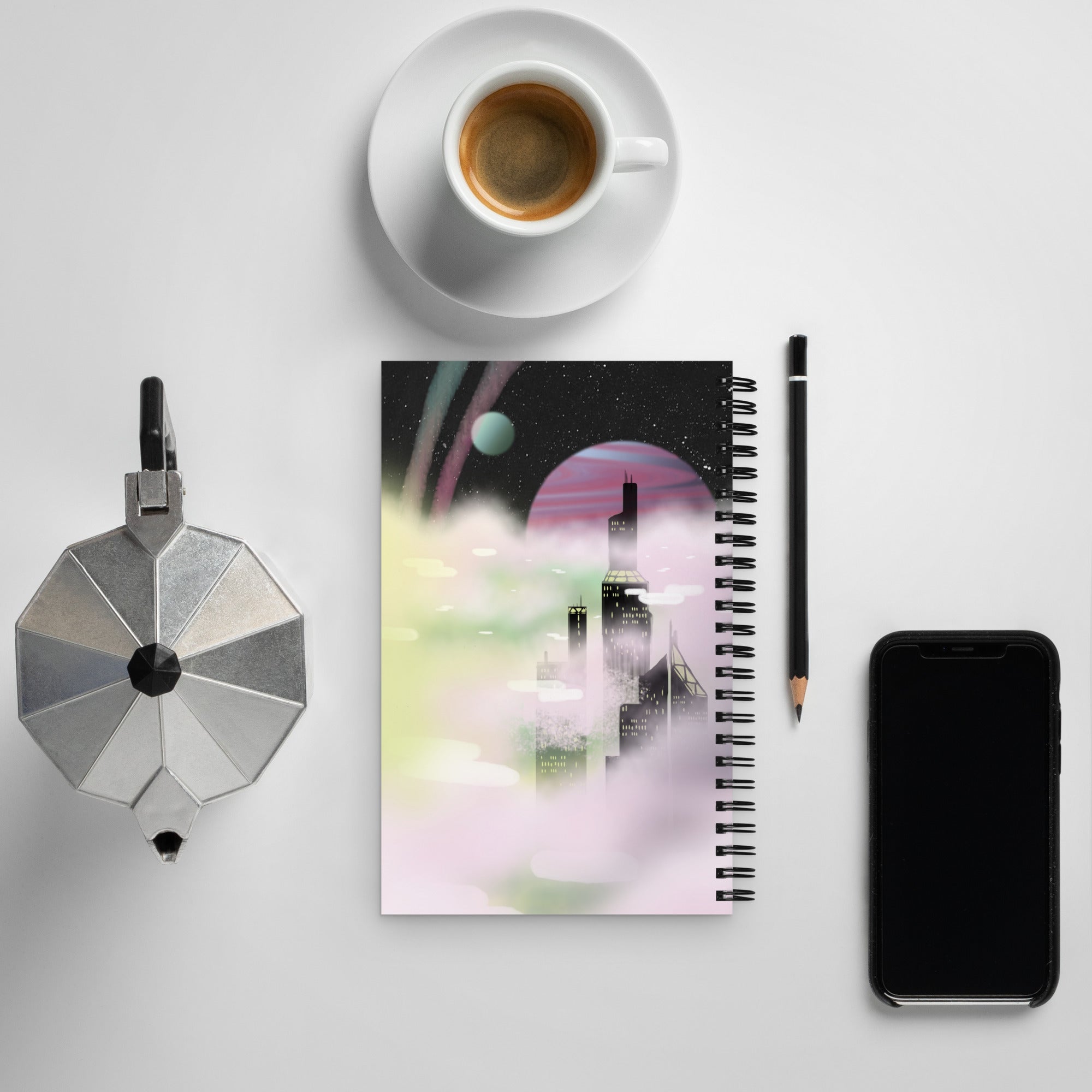 Close-up of the spiral binding showcasing matte black coils and textured cover edge detail from an overhead perspective.