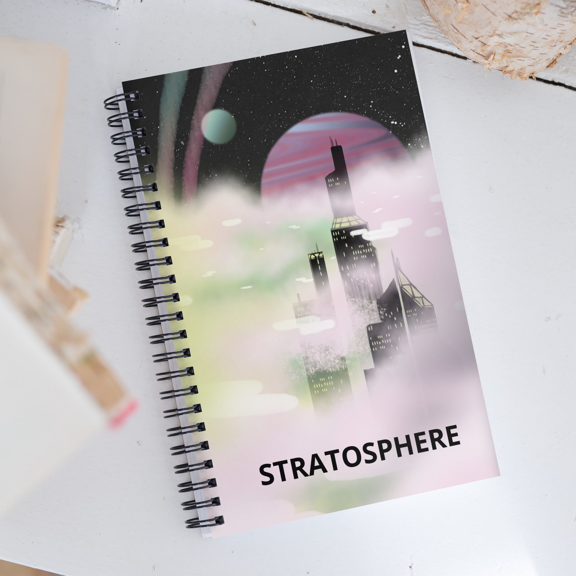 Close-up of the spiral binding with textured black wire coils and the edge of the recycled kraft cover revealing subtle