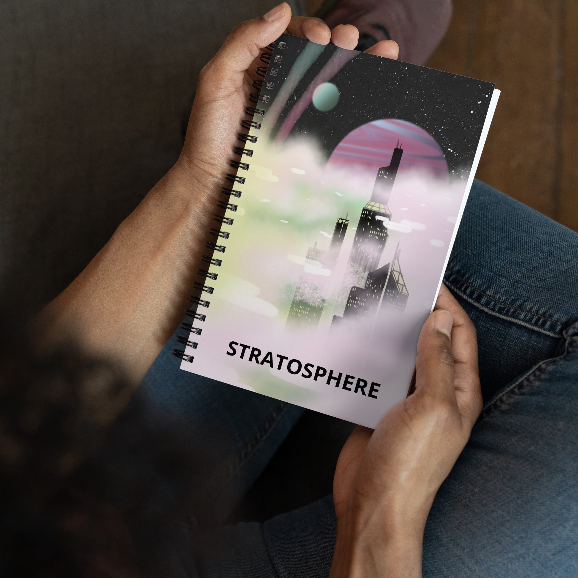 Close-up of the spiral binding’s textured metal coils and exposed edges on the Stratosphere notebook’s top corner