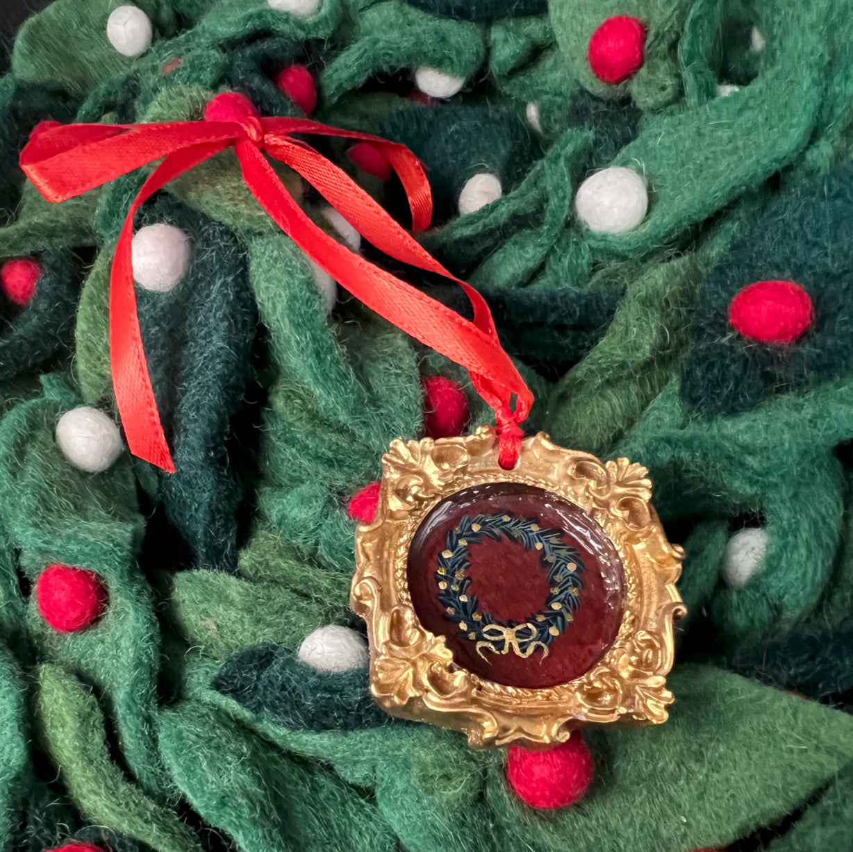 CFD Festive Wreath with red velvet ornaments, pinecones, and burlap bow, 12-inch diameter, handcrafted by The Art Collective